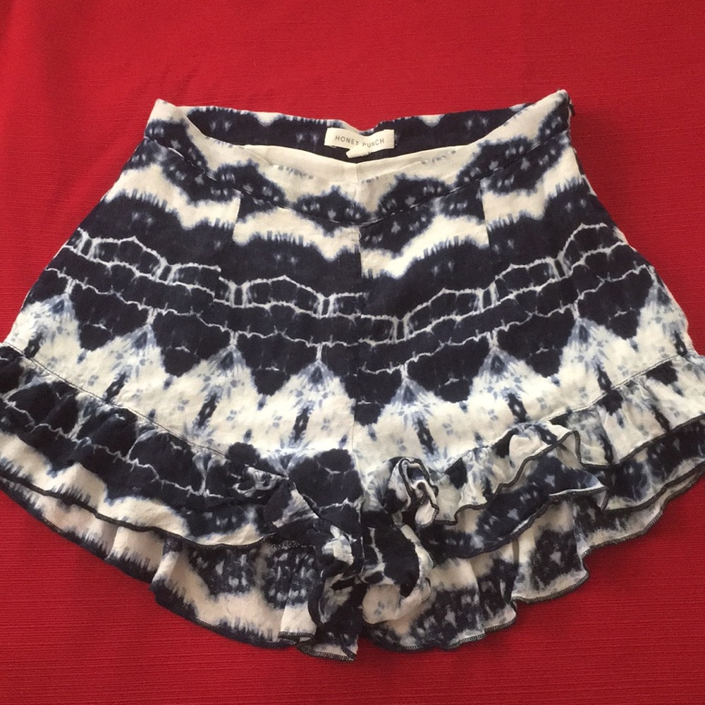 Blue and white comfy shorts with ruffle bottoms.